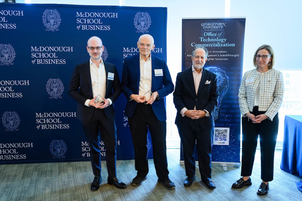 Innovator of the Year award recipients Alexander Kroemer and Anton Wellstein with Spiros Dimolitsas and Tatiana Litvin-Vechnyak (left to right).